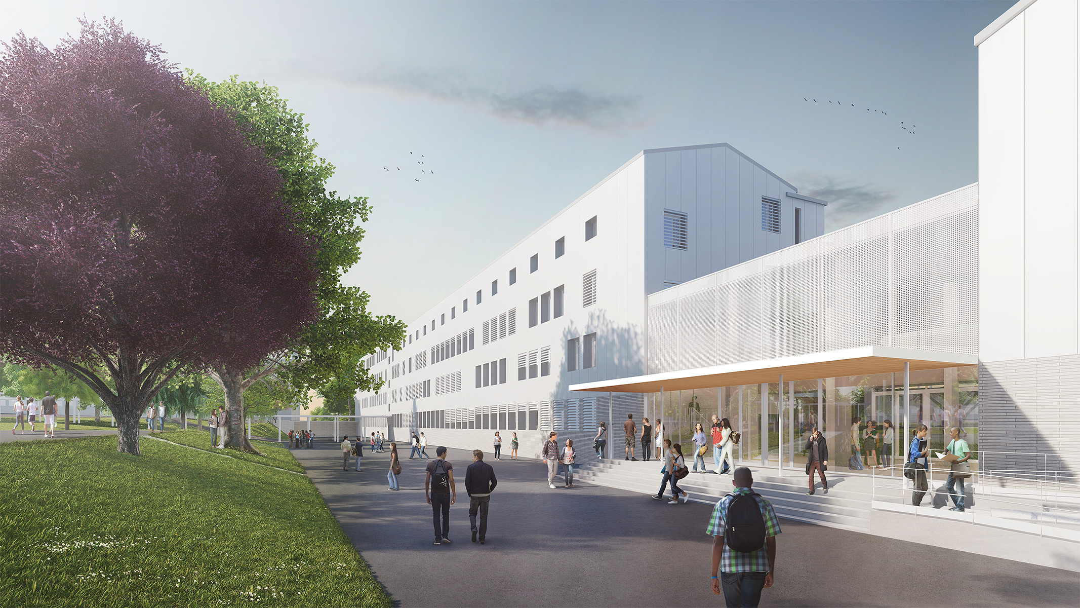Perpective depuis l'entrée du bâtiment principal, le ciel éclaire la facade blanche du lycée Mounier